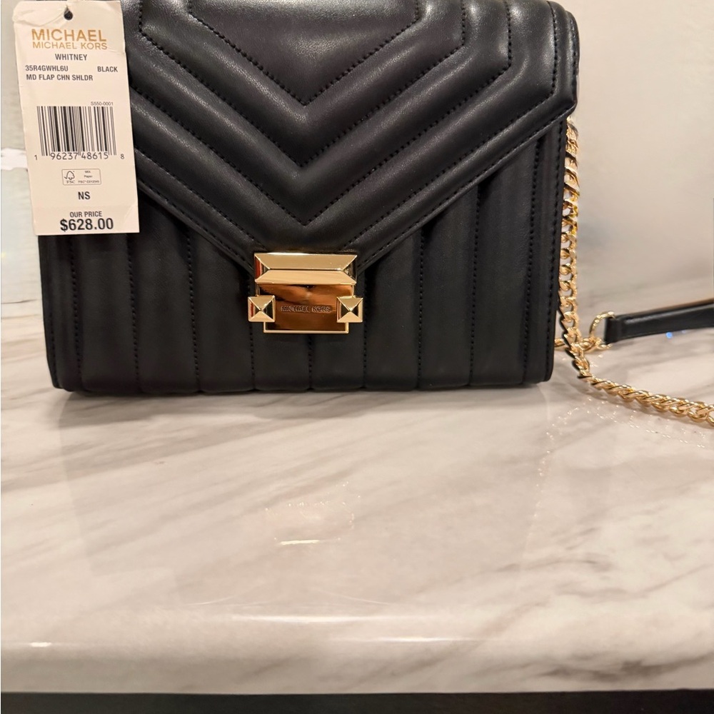 Michael Kors Black Quilted Crossbody Bag with Gold Accents
New with Tags